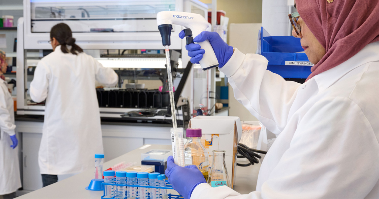Three women working in the lab.
